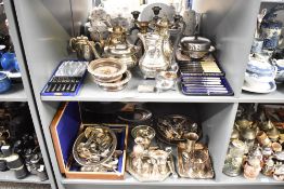 A large quantity of silver plated ware, to include tea pots, coffee pots, cutlery, sauce boat and