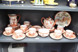 A vintage Japanese Kutani Porcelain tea service, hand coloured having traditional landscape scenes