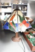 A Tiffany style table lamp decorated with red, blue and green floral patterns, h42cm