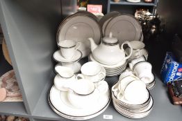 A Royal Doulton 'Sarabande' pattern Fine Bone China tea service, decorated with silver colour edging
