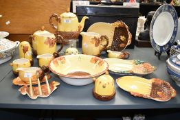 A Burleigh ware ceramic dinner service, having pine and leaf decoration, makers mark to base,