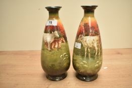 A pair of Simon Fielding & Co ceramic vases of ovoid form, decorated with cattle and landscape scene