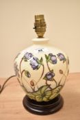 A Moorcroft pottery 'Ashwood' pattern table lamp of bulbous form, h21cm