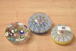 A Millefiori style glass paperweight, L6.5cm, sold together with two similar paperweights, (3)