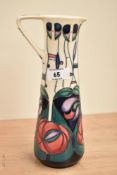 A Moorcroft pottery ewer, decorated in the 'Tribute to Charles Rennie Macintosh' pattern, designed