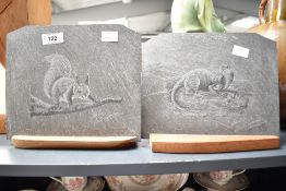 A slate plaque mounted on an oak base, engraved with squirrel on branch, signed Adrian Lewis-