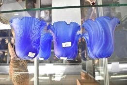 A set of 6 blue glass shades having ruffled edges, h12cm