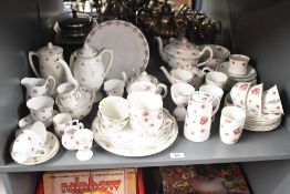 A Royal Doulton 'Forget-Me-Not' pattern tea service, having gilt edges and floral patterns, to