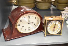 An early 20th century 8-day arched mahogany mantel clock, w33cm, sold together with a Quartz