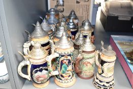 A quantity of Marzi & Remy lidded beer stein's, decorated in a variety of scenes including tavern
