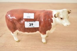 A Beswick pottery Hereford Cow, makers mark to base, L16.5cm