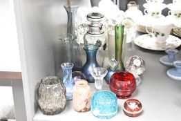 A collection of seventeen glass vases, paperweights, and scent bottles, including Caithness,