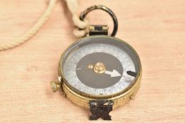 An early 20th century brass compass engraved No. 68622 to base, w5cm
