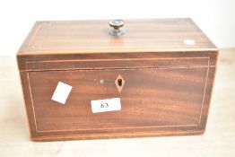 A 19th century tea caddy decorated with inlaid strunging and having a circular handle, the