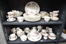 A Royal Albert 'Lavender Rose' pattern dinner service, decorated with floral designs on a white
