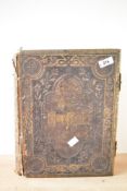 A 19th century Brown's Holy Family Bible bound in leather with metal clasps, h34cm