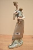 A Lladro porcelain figure group 'Mother and Child' model number 4710, measures 35cm.