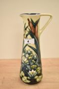 A Moorcroft 'Lamia' jug designed by Rachel Bishop, decorated with floral and foliage patterns on a