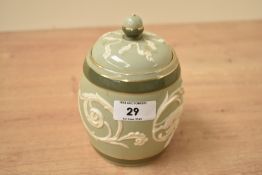 A James Macintyre & Co limited Washington Faience Burslem stoneware jar with cover, embossed with