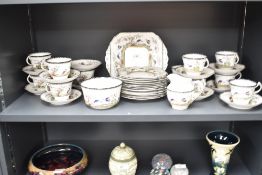 A Melba Rose pattern fine bone China part tea service decorated with tropical birds and foliage on a