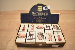 A carton of Sotheby's New Bond Street matchboxes, to include Lady Blunt Stradivarius, Meissen