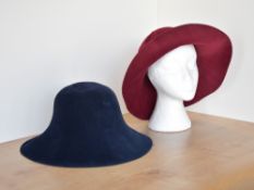 Two vintage women's Borsalino Italian hats, a navy blue and a burgundy red, wide bimmed bucket