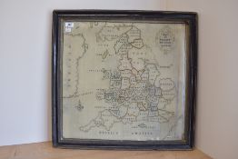 A framed 19th century cross stitch sampler by Sarah Crouch, depicting a Map of England. Framed in