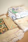 Eight peices of mid-century vintage home textiles, including six hand embroidered tablecloths or