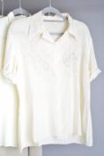 Two 1930-1940s silk short-sleeve shirts. One with the Charm label, in a pale bisque shade, having