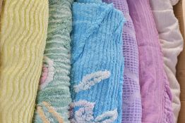 Six vintage towelling cotton throw blankets in summery pastel shades, one white, each having a