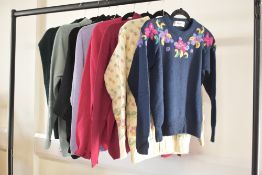 Eight pieces of ladies knitwear, including two cashmere V-neck examples, two floral designs, two