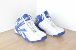 A pair of vintage Reebok The Pump trainers sneakers, in white leather with royal blue paten