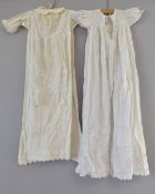 Two 20th century girls' white cotton nighties. Some small marks and discoloration due to age.