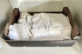 A quantity of crochet tablecloths and home linens, including white cotton and crochet examples,