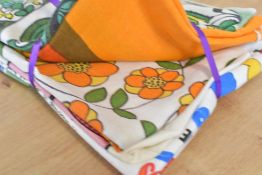 Six 1960-1970s linen and Irish linen tea towels, in bold retro colours with various designs,