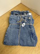 Two pairs of 1980s denim jeans. A pair of Cappopera fitted jeans, having darts at the waist and blue