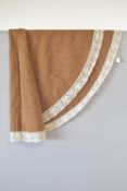 A 1950s Sturzenegger circlular tablecloth in latte brown boucle textured weave wool, with a cream