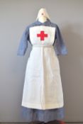 A vintage Red Cross nurses uniform comprising a Harrods chambray dress measuring 32 inches at the