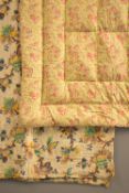 Two mid-century blankets. A paisley Eiderdown blanket, in lemon yellow poplin with multi-coloured