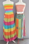 A collection of vintage ladies cotton summer wear, in bright stripes of pink, yellow, orange, greens