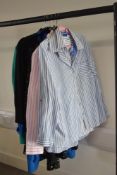 A capsule collection of modern womens work wear, comprising five striped shirts in blue/white and