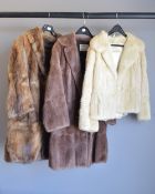Three vintage fur coats featuring wide notched lapels, including two Hutcheson Furs of Lancaster,