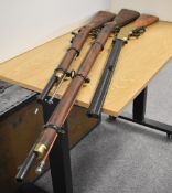 London Armoury, two non-firing replicas of a percussion-cap musket rifle, engraved to the