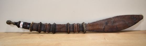 African possibly Nigerian origin tribal sword and decorative leather sheath, the curved blade made