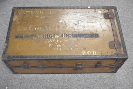 Early 20th Century leather bound travelling or steamer trunk, with maker and/or supplier plate,