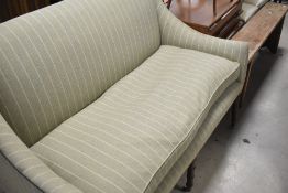 A Victorian style stained frame salon settee with later tweed upholstery, width approx. 137cm