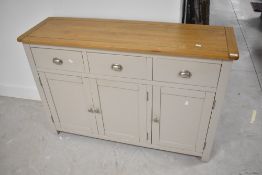 A modern wood and laminate modern sideboard unit, width approx. 129cm