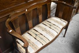 An Edwardian mahogany salon settee, width approx. 116cm