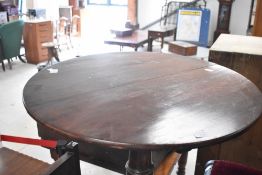 A 19th Century mahogany pedestal table having circular snap top, turned column and triple splay