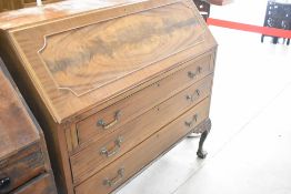 An early 20th Century bureau, on ball and claw feet, width approx. 107cm